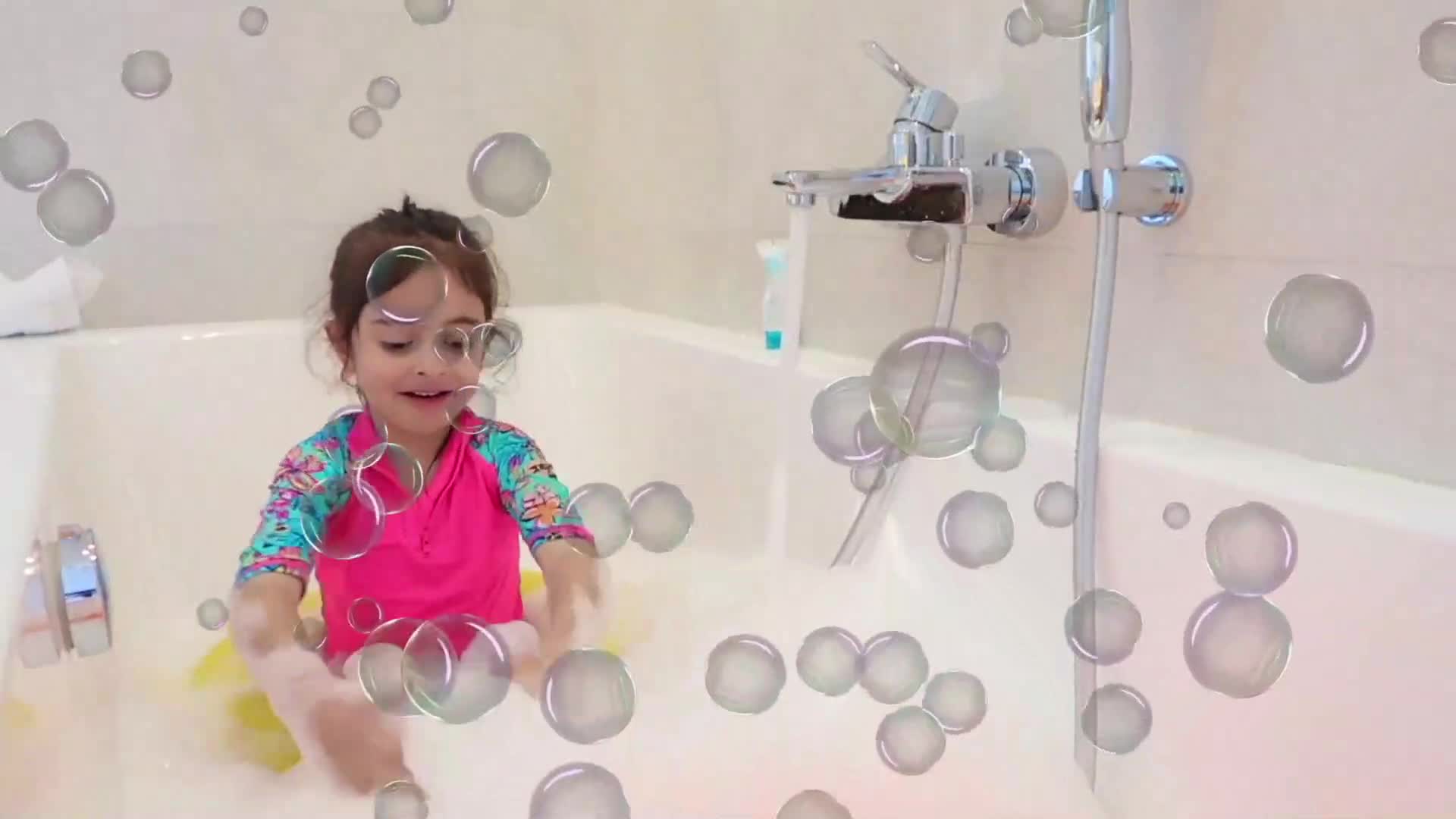 A sweet little girl enjoys a bubbly bath, splashing and playing with glistening soap bubbles! Full of giggles and joy, this heartwarming moment is perfect for little ones—soapy, sparkly, and full of smiles! 🥰✨