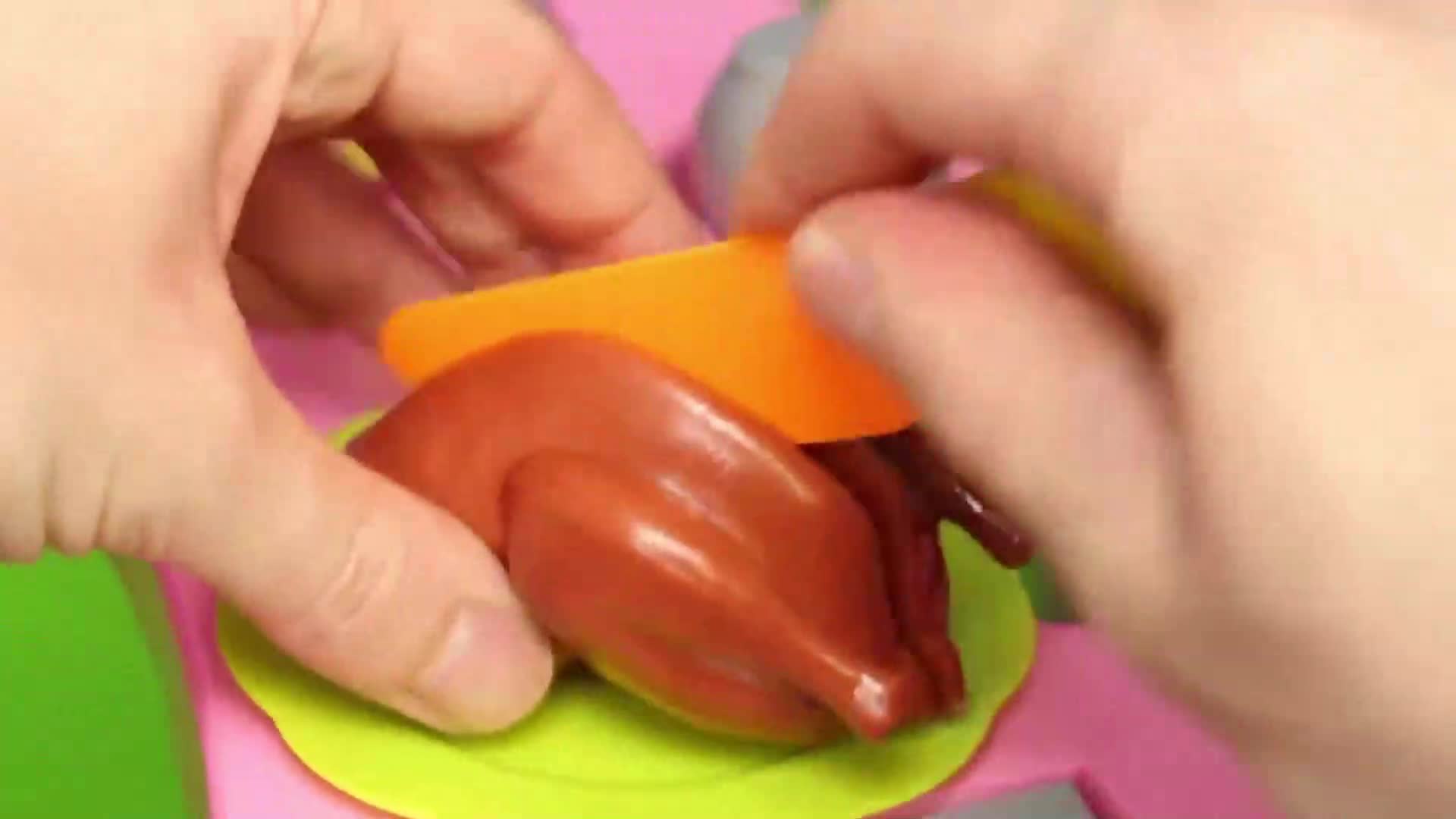 Watch little hands playfully 'cut' a toy turkey with a plastic knife—perfect for imaginative kitchen fun! Little ones will love this pretend play scene, exploring cutting and role-playing. 🎭🍽️✨