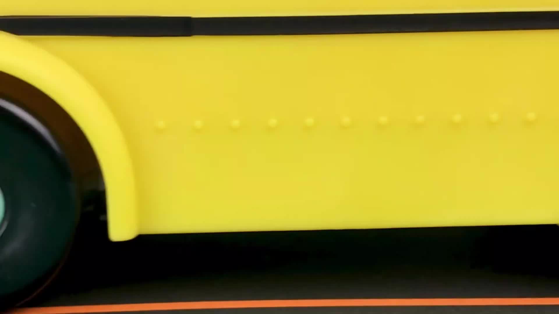 Look at this bright yellow school bus toy! See the fun black stripes, cool little rivets, and smooth black wheels. It's perfect for little drivers to play with! 🌟 #ToyTrucks #KidsToys