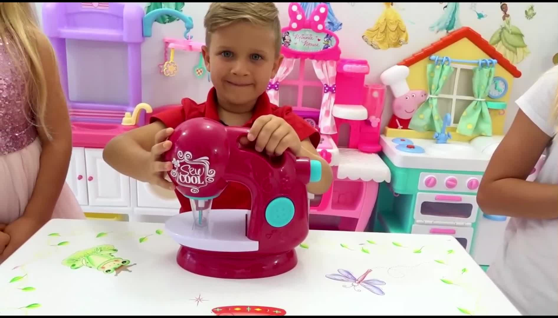 A cute little boy is having fun with his new Sew Cool toy sewing machine! 🌈 He's playing pretend in a colorful playroom with fun toy kitchens and princess decorations 🏠. Watch him explore and create with this fun toy—perfect for imaginative playtime! 👧✨