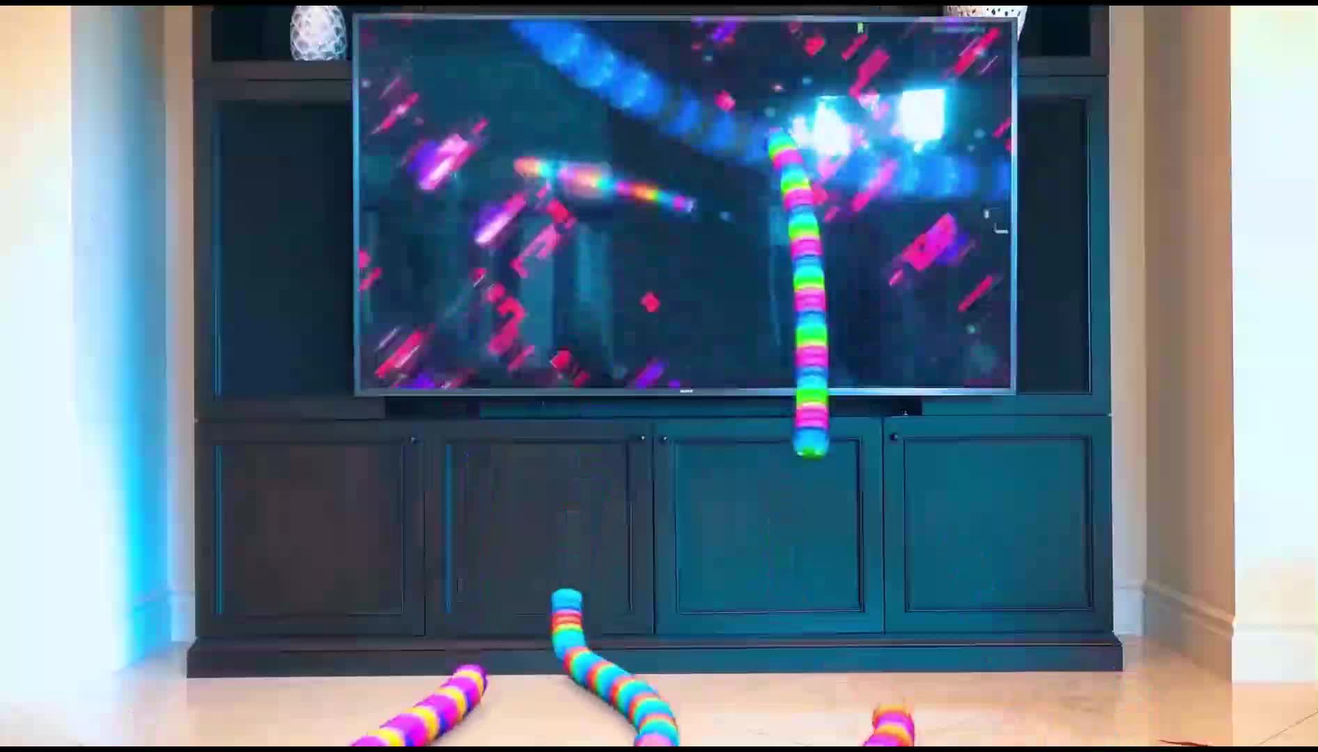 Watch these vibrant, rainbow-colored snake toys slither and dance along with the TV game! Perfect for playful kids, with bright hues and exciting movements that match the screen—interactive, colorful, and full of joy! 🎈✨