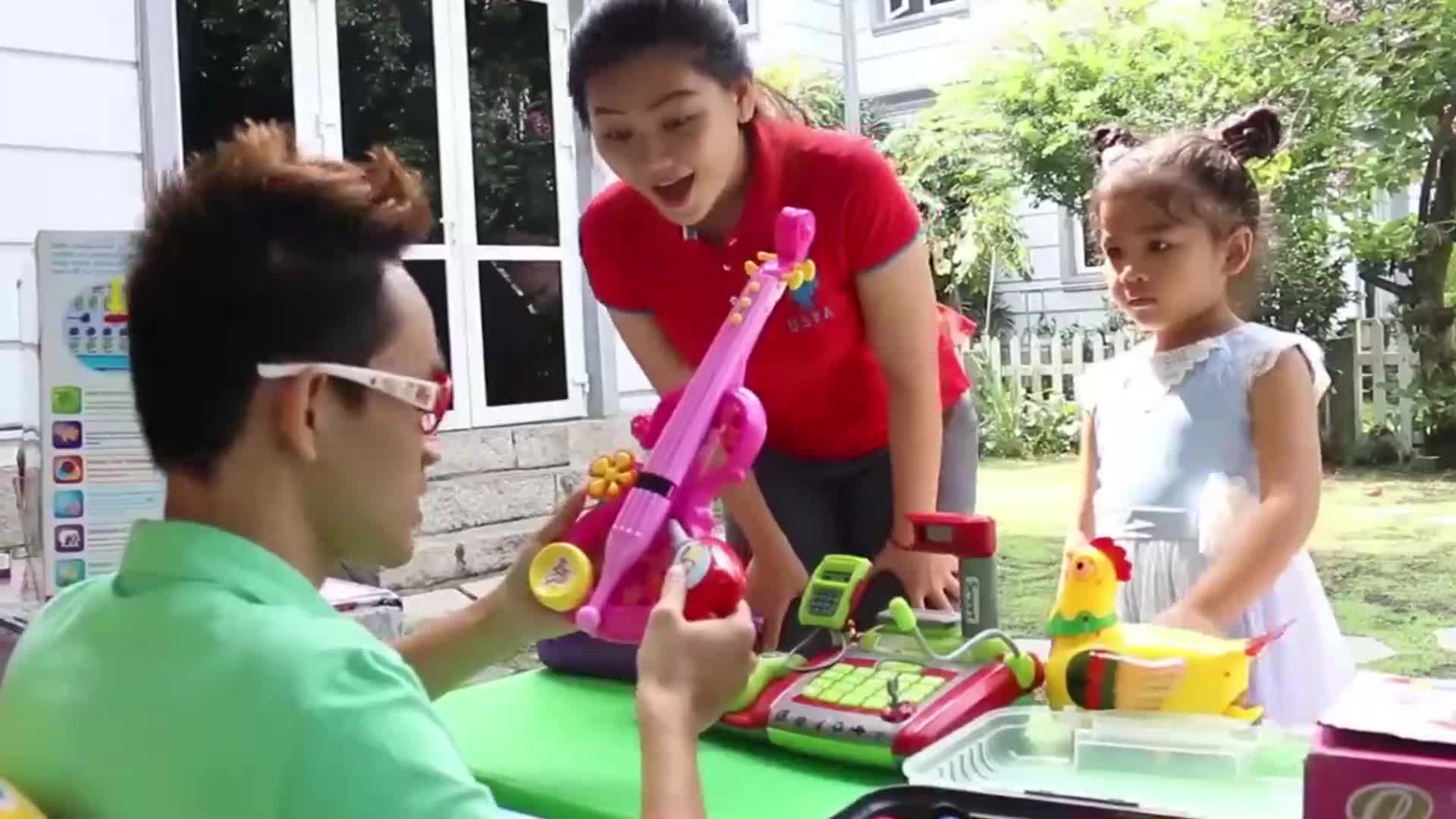 Adorable kids are having a wonderful time playing with bright, fun toys in a sunny garden! 🌞 They're exploring a pink toy guitar, a colorful toy cash register, and a cute little chicken toy—so much laughter and joy! 🎈👧👦✨ Watch as they interact and enjoy their playdate with family! 🥰