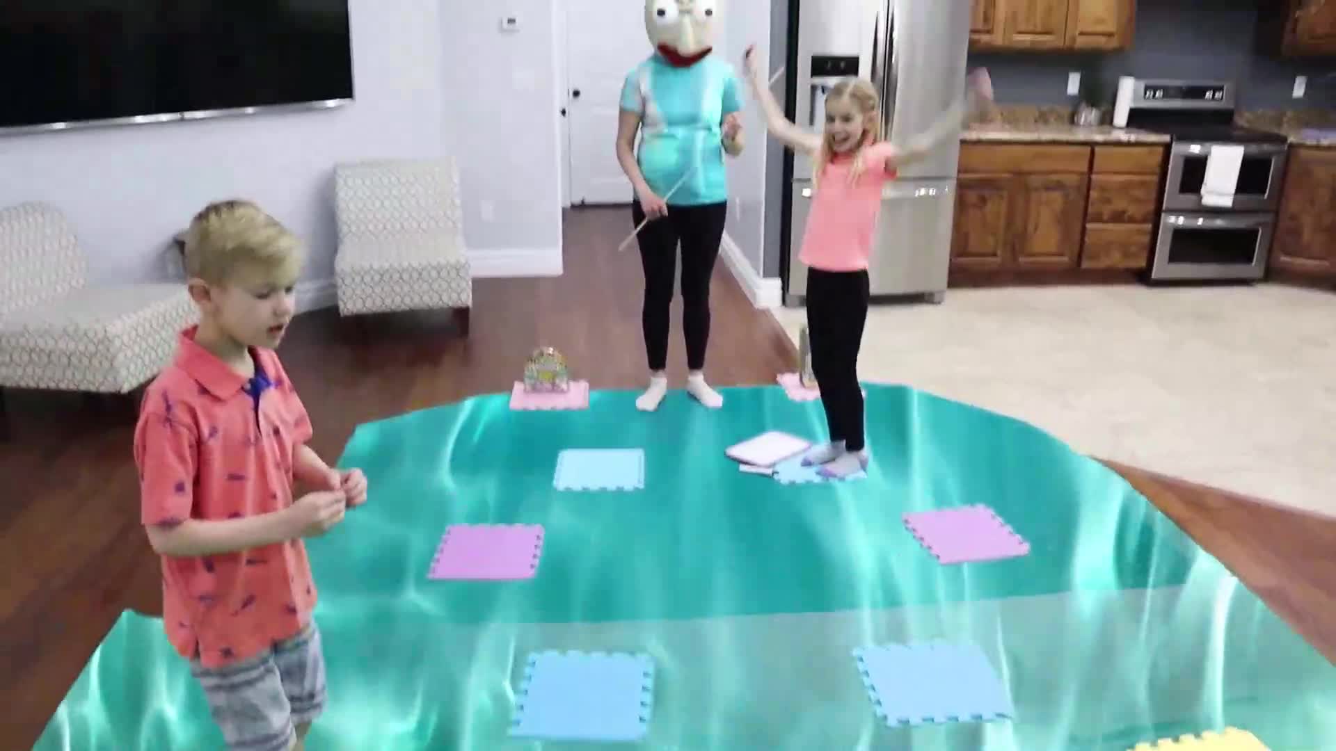 Watch these little ones have a blast playing a fun dance and hop game with a masked friend! They’re jumping on colorful foam mats, laughing, and enjoying a lively family activity in their cozy living room. Full of energy and smiles, this video is perfect for kids and families looking for some playful inspiration! 🎉😊🏠