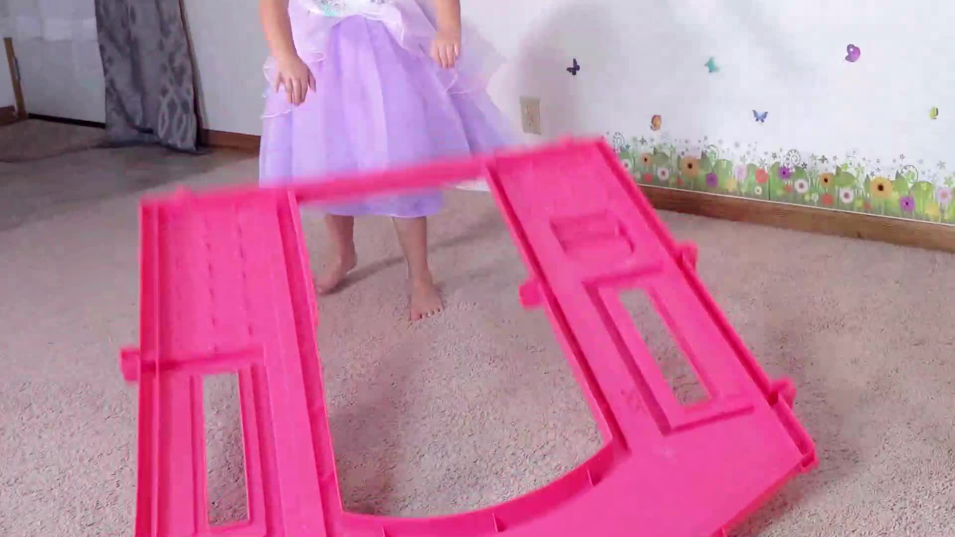 A little princess in a purple tutu is having a great time with her bright pink toy track! 🌈 She’s playing, exploring, and laughing—so much fun for tiny adventurers! 😊 #ToyPlay #PrincessFun