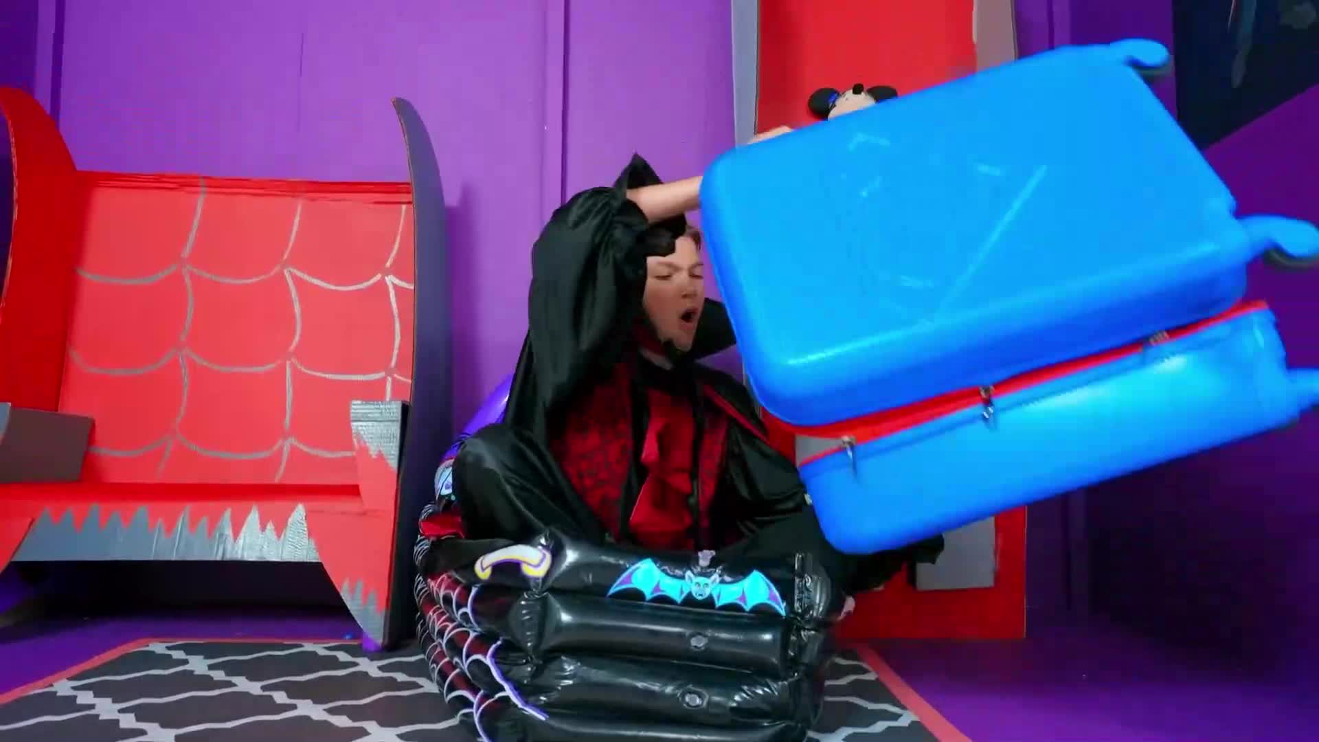 A little vampire is having a spooky-fun time in his inflatable bat pool! 🦇 He's grabbing his blue suitcase 🧳 and getting ready to pack for a magical adventure—will he fit all his favorite things? 🌟 Watch to see the silly, playful fun!