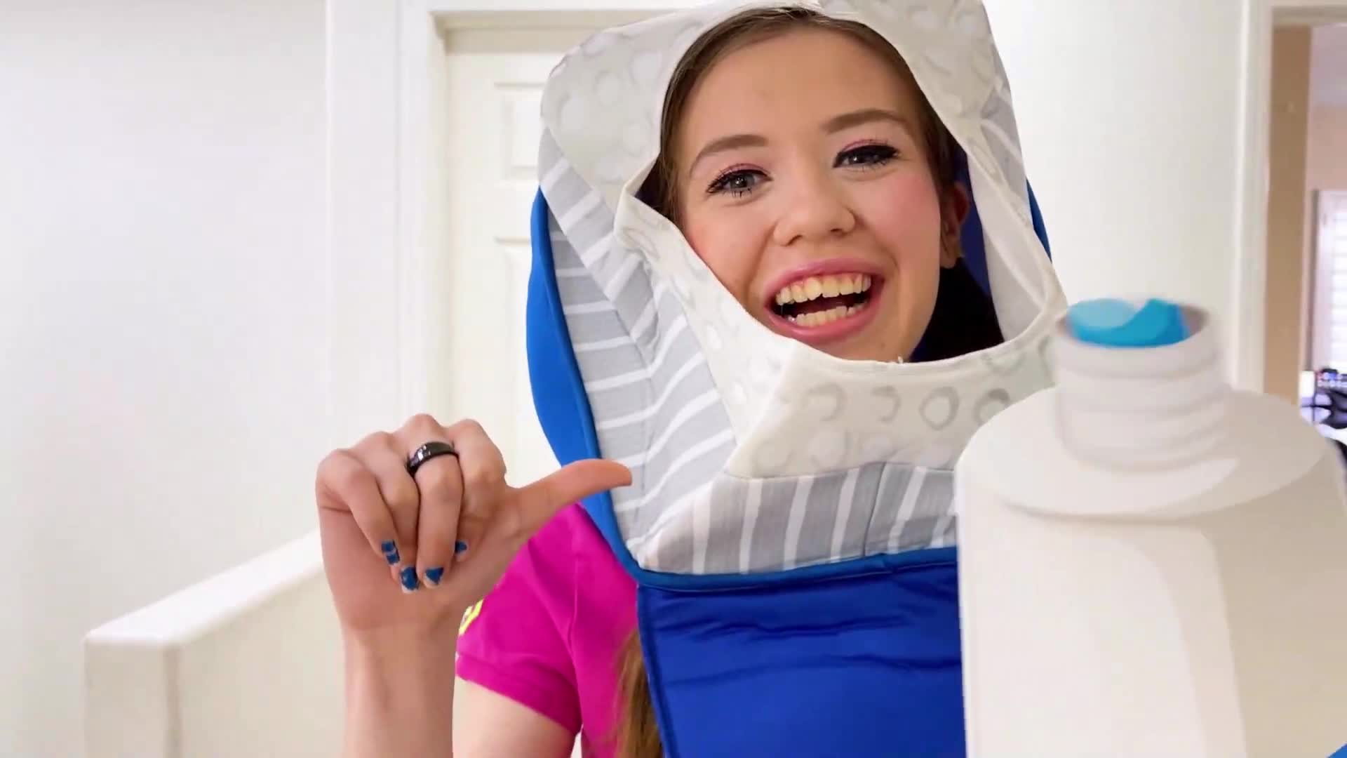 Watch this happy girl try on a funny hoodie and show off a cool white bottle—maybe it's a magic experiment or a playful cleaning hack? Join in the laughter and see what silly surprise happens next! 🌟